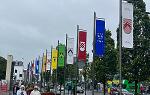A row of colorful banners hanging from poles along a street in Galway, 爱尔兰
